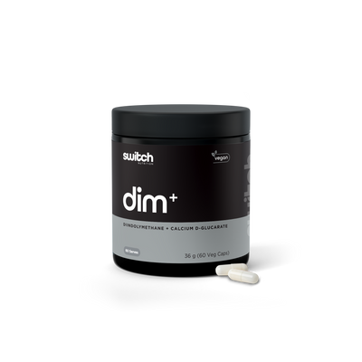 A container of Switch brand DIM+ supplements, which is vegan-friendly, featuring Diindolylmethane and Calcium D-Glucarate. The product packaging is a sleek, opaque container with a gradient of black to clear, highlighting the white and purple branding and text. It states '60 Serves' and '36 g (60 Veg Caps)' indicating the quantity of capsules inside.