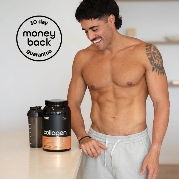 A shirtless man with a tattoo on his arm, smiling while standing in a kitchen. A large container of Switch Nutrition Collagen Protein and a shaker bottle are placed on the counter in front of him. The image includes a "30 day money back guarantee" badge.