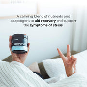 An image of a person holding a container of Switch Nutrition's 'adrenal' supplement, with text above stating it's a calming blend for recovery and stress support, and a hand making a peace sign in the foreground.