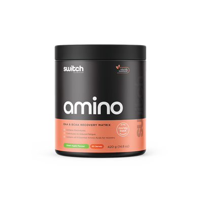 Container of Switch Nutrition's 'amino' in green apple flavor, an EAA & BCAA recovery matrix, which contains electrolytes and all 9 essential amino acids for recovery. The product is naturally sweetened, offers 30 servings, and the weight is 210 grams (7.4 oz) with a 30 day money back guarantee' emblem.