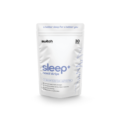 A white package of Sleep+ Nasal Strips by Switch Nutrition, featuring the tagline "a better sleep for a better you." The packaging highlights that the product lifts and opens nasal passages, enhances airflow, reduces snoring, and promotes restful sleep. The package contains 30 strips.