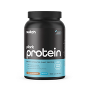 Black container of Switch Nutrition Protein labeled 'Organic Sprouted Plant Protein' in Vanilla Bean flavour with a '30-day money back guarantee' and '#1 plant protein' badge, containing 30 servings at 900g.