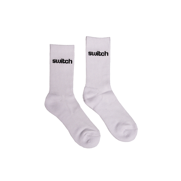 Switch Nutrition signature white crew socks with black logo, featuring a ribbed design and durable construction for workout and everyday comfort.