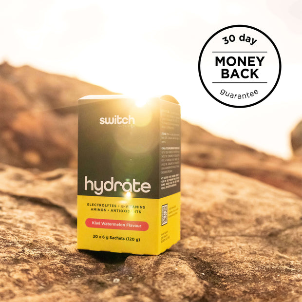 Hydrate box in a sunny, outdoor setting with the sun in the background, emphasizing the 30-day money-back guarantee.