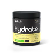 Switch Nutrition HYDRATE Electrolyte Rehydration Blend in Lemon Lime Flavor, 150g container with 25 servings, displaying no added sugar or caffeine, and enriched with B-vitamins, taurine, and antioxidants, with a 60-day money-back guarantee seal.
