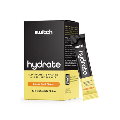 Packaging for Switch Nutrition Hydrate sachets in Orange Crush Flavour, displaying the box and a single sachet. The box states it contains electrolytes, B-vitamins, aminos, and antioxidants, with 20 x 6g sachets inside.