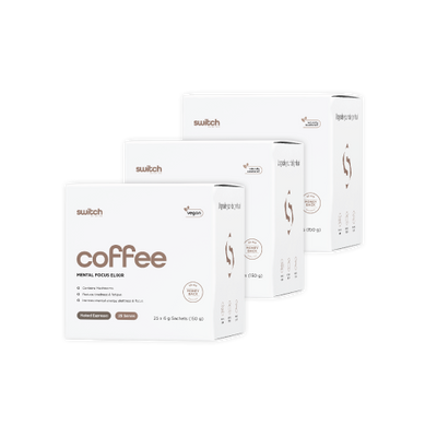 A collection of 'Switch Nutrition' product boxes for 'coffee,' a mental focus elixir. The vegan-friendly products are displayed in varying sizes with one box highlighted in front. The packaging features clean white design with orange accents, including details about the product being naturally flavored