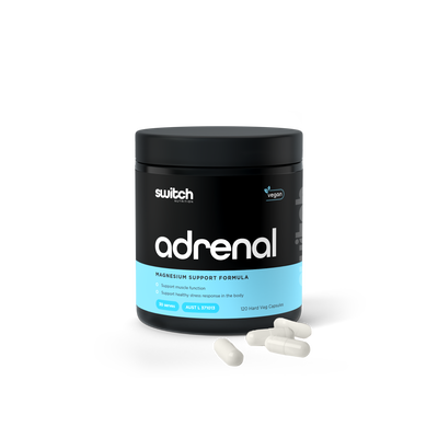  A container of "Switch Nutrition" adrenal magnesium support formula, with benefits listed and capsules displayed in front, on a transparent background.